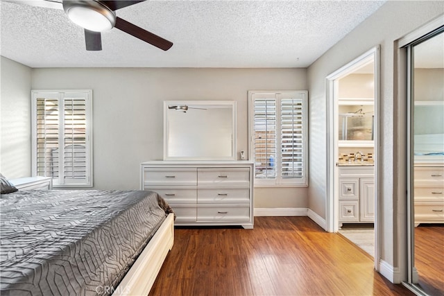 3718 Berkshire Rd, Pico Rivera, CA 90660 - bedroom with multiple windows, wood finished floors, a textured ceiling, ceiling fan, and ensuite bath