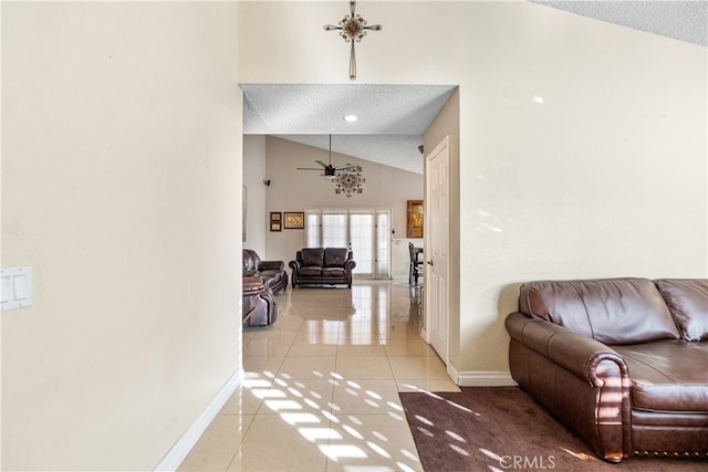 3718 Berkshire Rd, Pico Rivera, CA 90660 - living area with light tile patterned flooring, ceiling fan, lofted ceiling, and a textured ceiling