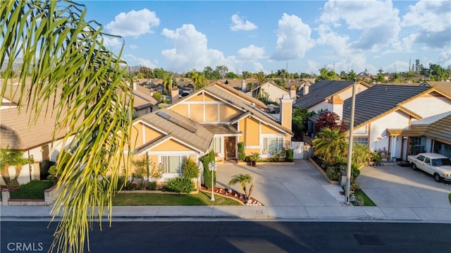 3718 Berkshire Rd, Pico Rivera, CA 90660 - view of front facade featuring a residential view, driveway, and a chimney