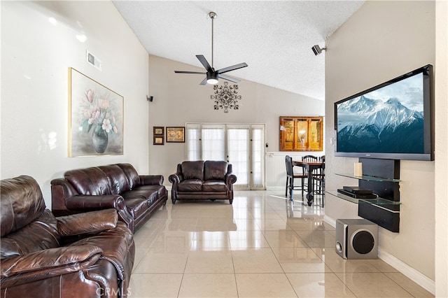 3718 Berkshire Rd, Pico Rivera, CA 90660 - living room with ceiling fan, lofted ceiling, light tile patterned floors, and a textured ceiling
