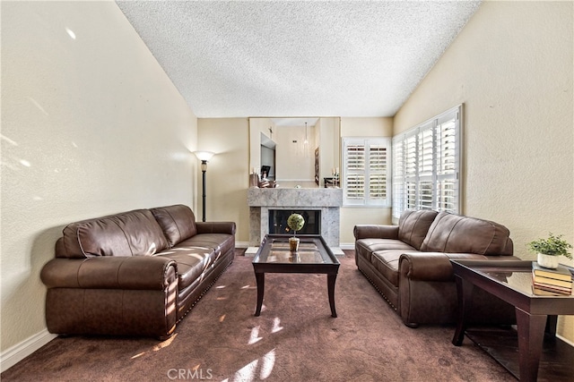 3718 Berkshire Rd, Pico Rivera, CA 90660 - carpeted living area with a textured ceiling, a textured wall, a high end fireplace, and lofted ceiling
