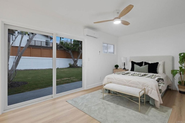709 Puebla St, Encinitas, CA 92024 - bedroom with a wall unit AC, wood finished floors, access to exterior, and a ceiling fan