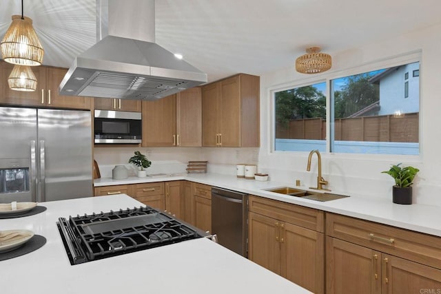 709 Puebla St, Encinitas, CA 92024 - kitchen with wall chimney range hood, stainless steel appliances, light countertops, pendant lighting, and brown cabinetry