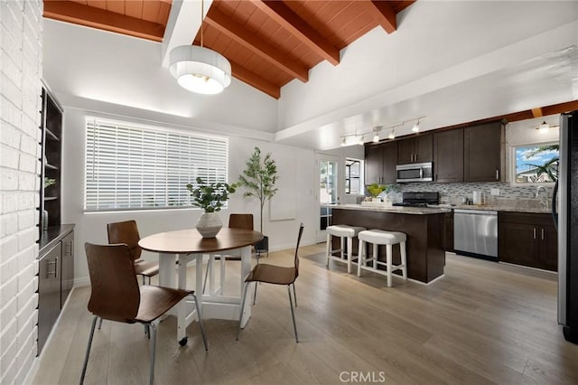 15352 Pastrana Dr, La Mirada, CA 90638 - dining room featuring wooden ceiling, light wood-style flooring, and rail lighting