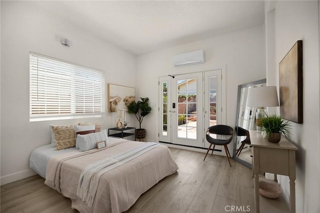 15352 Pastrana Dr, La Mirada, CA 90638 - bedroom featuring a wall mounted air conditioner, access to outside, and light wood finished floors