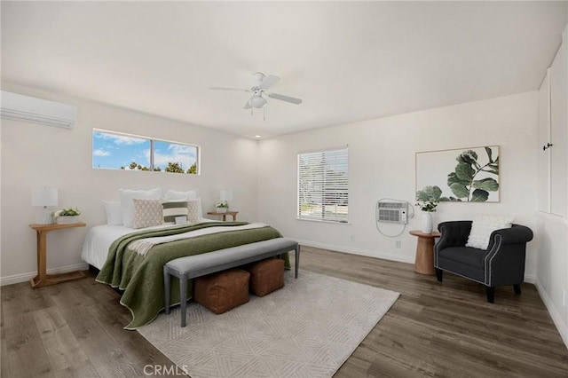 15352 Pastrana Dr, La Mirada, CA 90638 - bedroom with a wall unit AC, wood finished floors, an AC wall unit, and a ceiling fan