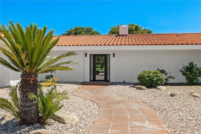 32641 Womsi Rd, Pauma Valley, CA 92061 - property entrance with a tiled roof and a chimney