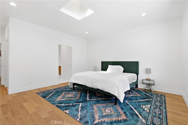 32641 Womsi Rd, Pauma Valley, CA 92061 - bedroom featuring a skylight, wood finished floors, and recessed lighting