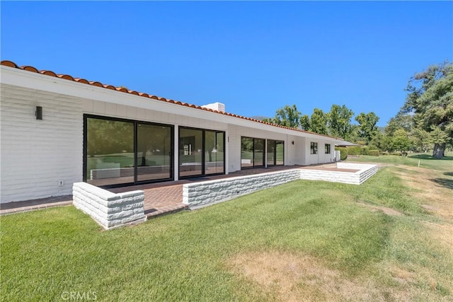32641 Womsi Rd, Pauma Valley, CA 92061 - rear view of house featuring a lawn and a tile roof