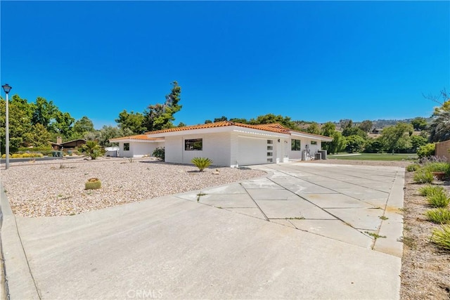 32641 Womsi Rd, Pauma Valley, CA 92061 - mediterranean / spanish home with driveway, a garage, and a tiled roof