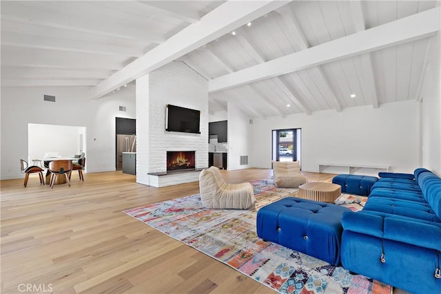 32641 Womsi Rd, Pauma Valley, CA 92061 - living room featuring a brick fireplace and wood finished floors