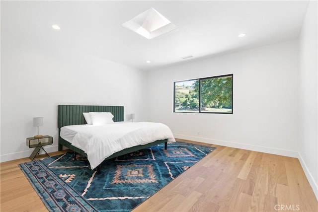 32641 Womsi Rd, Pauma Valley, CA 92061 - bedroom featuring wood finished floors, a skylight, and recessed lighting