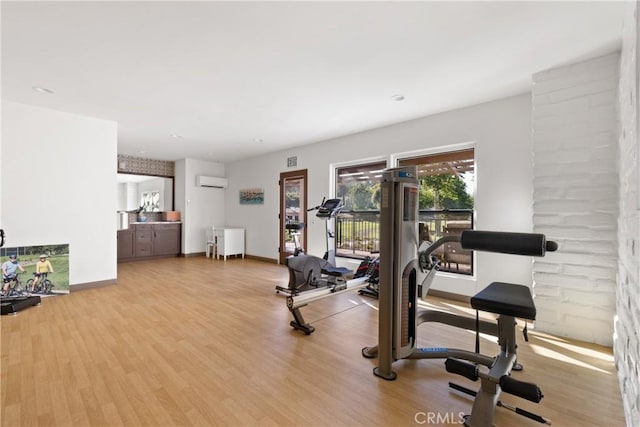 32641 Womsi Rd, Pauma Valley, CA 92061 - workout room with a wall unit AC, wood finished floors, and recessed lighting