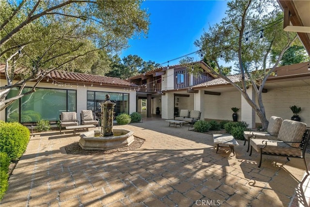 32641 Womsi Rd, Pauma Valley, CA 92061 - back of house featuring a tile roof and a patio area