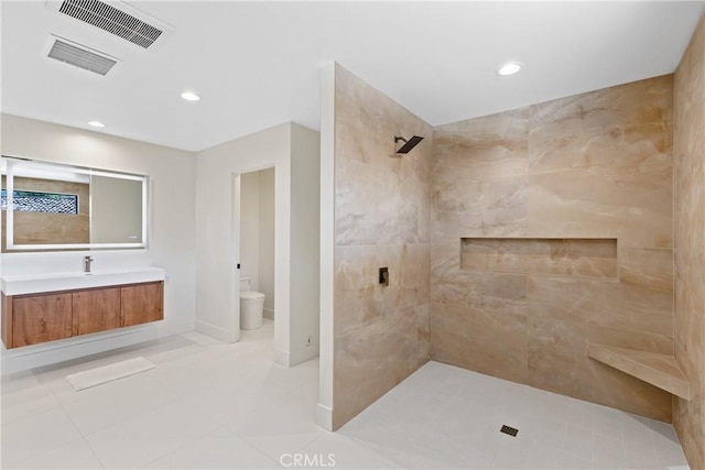 32641 Womsi Rd, Pauma Valley, CA 92061 - bathroom with a tile shower, tile patterned flooring, vanity, and recessed lighting