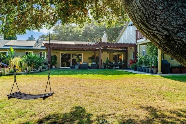 947 Calimex, Nipomo, CA 93444 - back of property featuring an outdoor hangout area, a pergola, stucco siding, solar panels, and a lawn