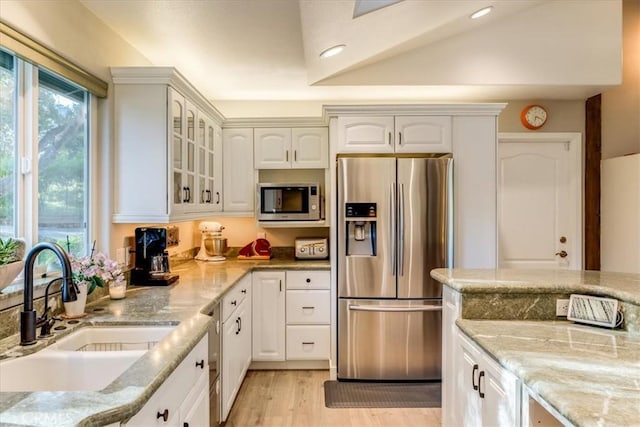 947 Calimex, Nipomo, CA 93444 - kitchen with stainless steel appliances, glass insert cabinets, light stone counters, white cabinets, and recessed lighting