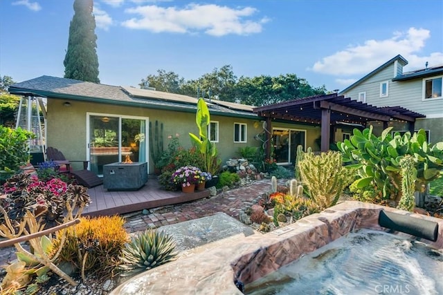 947 Calimex, Nipomo, CA 93444 - rear view of property featuring stucco siding, a wooden deck, solar panels, and a pergola