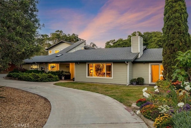 947 Calimex, Nipomo, CA 93444 - view of front of property with concrete driveway, a front lawn, a chimney, and roof with shingles