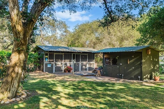 947 Calimex, Nipomo, CA 93444 - back of property featuring an outbuilding, a metal roof, and a yard