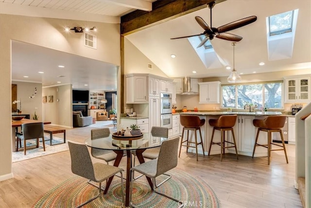 947 Calimex, Nipomo, CA 93444 - dining space with a skylight, a ceiling fan, high vaulted ceiling, beam ceiling, and light wood-style flooring