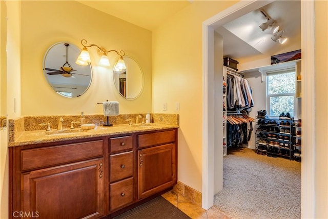 947 Calimex, Nipomo, CA 93444 - bathroom with double vanity, rail lighting, a walk in closet, and a ceiling fan