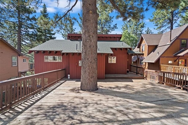 33211 Juniper Ln, Green Valley Lake, CA 92341 - back of house featuring roof with shingles and a deck