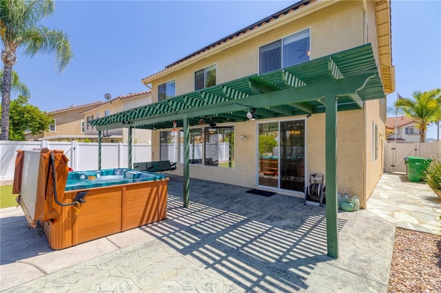 23832 Matador Way, Murrieta, CA 92562 - back of property with a hot tub, stucco siding, and a patio area