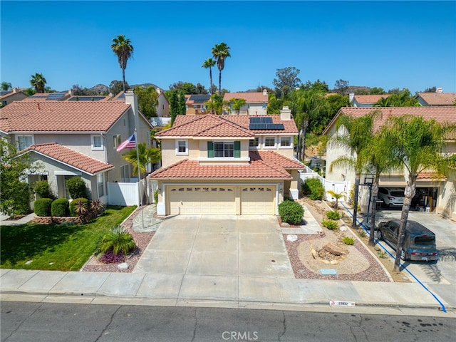 23832 Matador Way, Murrieta, CA 92562 - view of front facade with a tiled roof, stucco siding, roof mounted solar panels, and a residential view