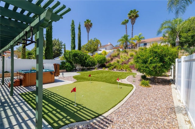 23832 Matador Way, Murrieta, CA 92562 - fenced backyard with a putting green, a hot tub, a pergola, and a patio