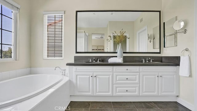 18 Via Canero, San Clemente, CA 92673 - full bathroom with double vanity, a garden tub, plenty of natural light, and tile patterned flooring