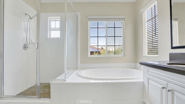 18 Via Canero, San Clemente, CA 92673 - bathroom with vanity, a stall shower, a bath, and plenty of natural light