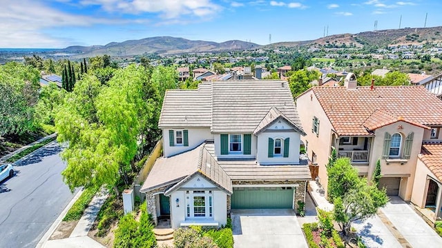 18 Via Canero, San Clemente, CA 92673 - view of front of property with stucco siding, a garage, driveway, a residential view, and a mountain view