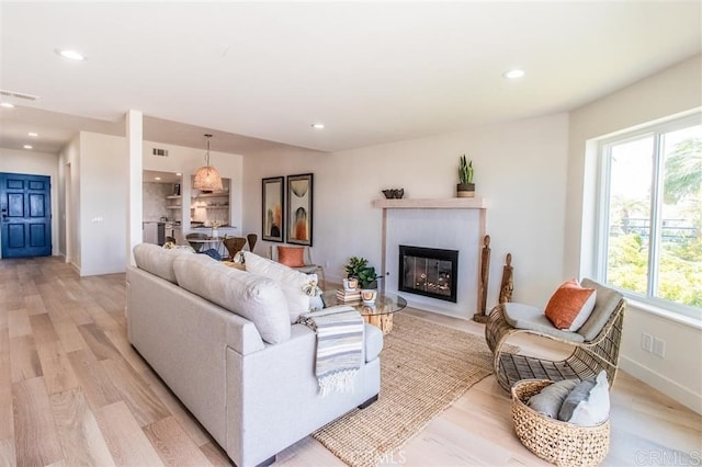 4026 Garfield St, Carlsbad, CA 92008 - living area featuring recessed lighting, light wood-style floors, and a fireplace with flush hearth