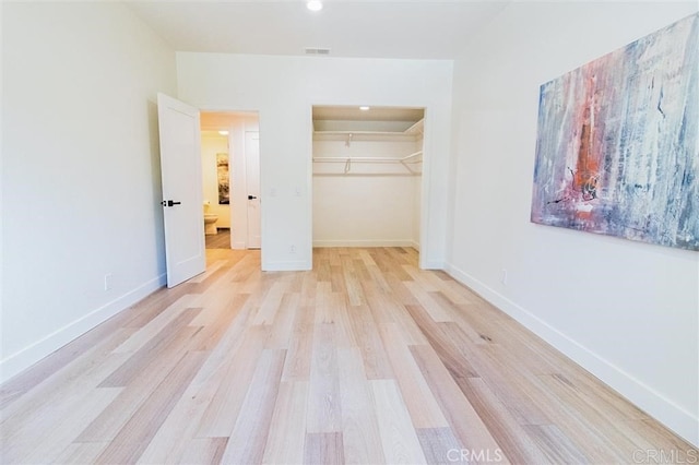 4026 Garfield St, Carlsbad, CA 92008 - unfurnished bedroom featuring light wood-style flooring, a closet, a walk in closet, and recessed lighting