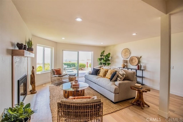 4026 Garfield St, Carlsbad, CA 92008 - living room featuring light wood-style flooring, a glass covered fireplace, and recessed lighting