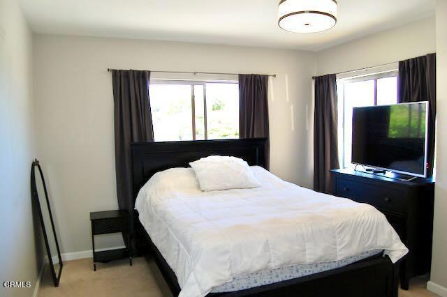 691 Via Ondulando, Ventura, CA 93003 - bedroom featuring multiple windows and light carpet