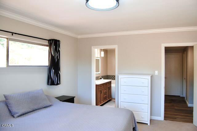 691 Via Ondulando, Ventura, CA 93003 - bedroom with crown molding and ensuite bathroom