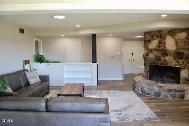 691 Via Ondulando, Ventura, CA 93003 - living room with wood finished floors, recessed lighting, and a fireplace