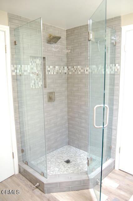 691 Via Ondulando, Ventura, CA 93003 - bathroom featuring wood finished floors and a stall shower