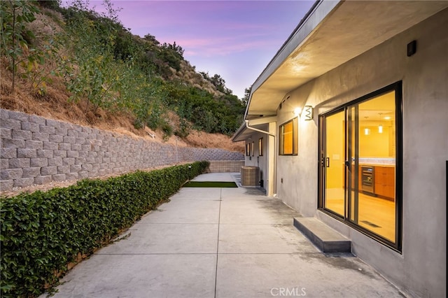 325 N Madison Ave, Monrovia, CA 91016 - patio terrace at dusk featuring a patio area and a fenced backyard