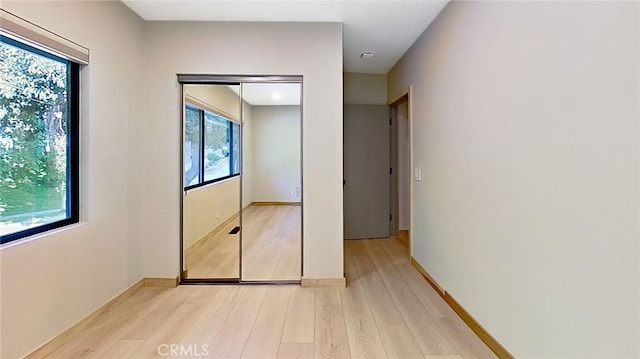 325 N Madison Ave, Monrovia, CA 91016 - unfurnished bedroom featuring light wood-style flooring and baseboards