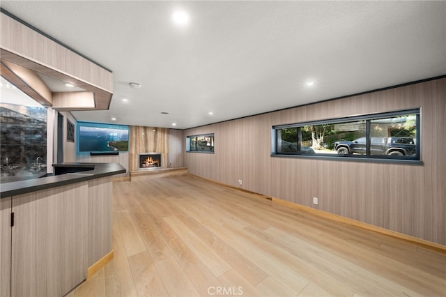 325 N Madison Ave, Monrovia, CA 91016 - unfurnished living room with a fireplace and light wood finished floors