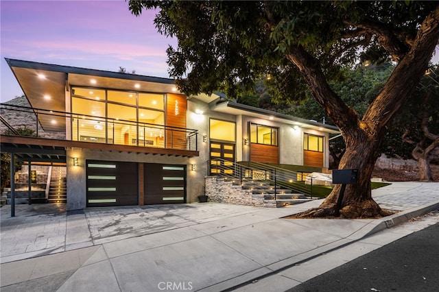 325 N Madison Ave, Monrovia, CA 91016 - contemporary home with concrete driveway and an attached garage
