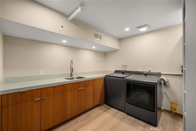 325 N Madison Ave, Monrovia, CA 91016 - washroom featuring washing machine and clothes dryer, light wood-type flooring, and recessed lighting