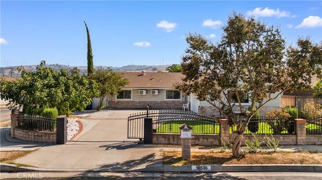 18536 Mescal St, Rowland Heights, CA 91748 - view of front facade featuring brick siding and a fenced front yard