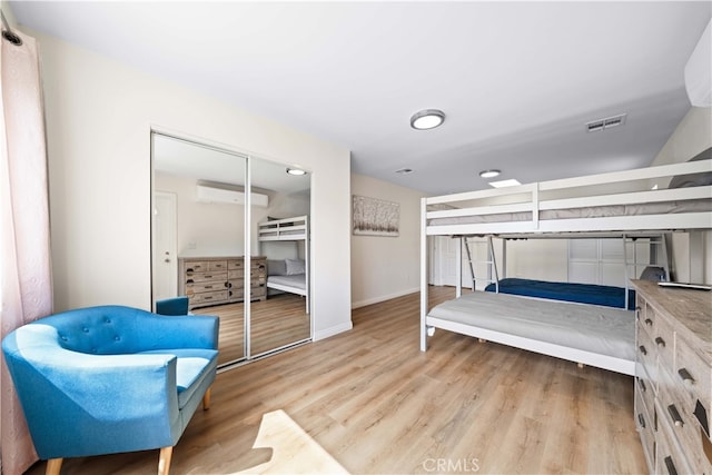 18536 Mescal St, Rowland Heights, CA 91748 - bedroom with a wall unit AC and light wood finished floors
