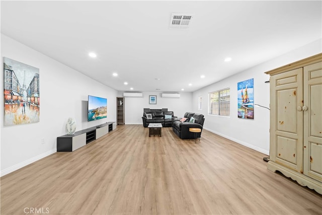 18536 Mescal St, Rowland Heights, CA 91748 - living room featuring light wood-style floors, a wall unit AC, and recessed lighting