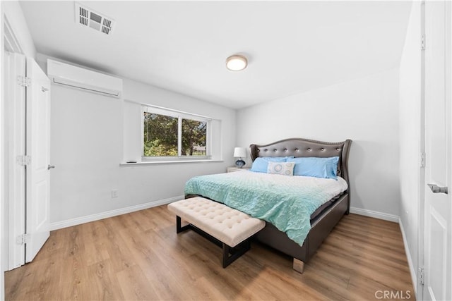 18536 Mescal St, Rowland Heights, CA 91748 - bedroom with a wall unit AC and wood finished floors