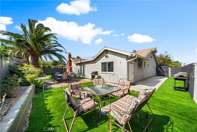18536 Mescal St, Rowland Heights, CA 91748 - rear view of house with a gate, a patio, a fenced backyard, and outdoor dining space